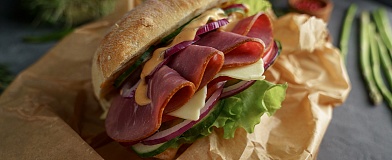 Sandwich with pastrami and vegetables with Tamaki Grill sauce